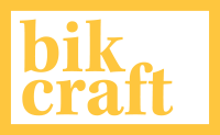 Logo amarelo escrito Bike-Craft